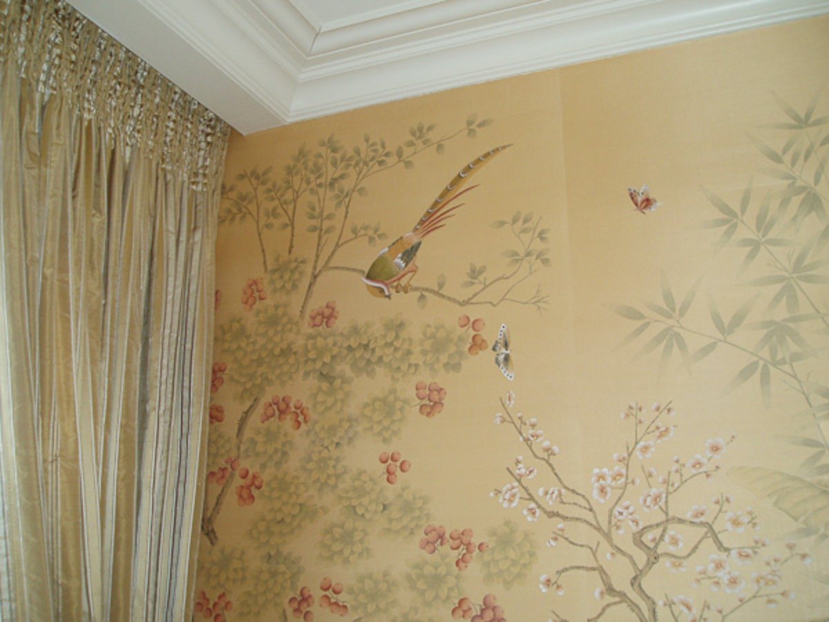 Gold antique silk wallcovering hand-painted with a pheasant, blossoms and butterflies